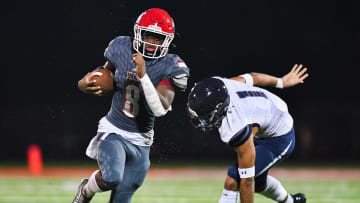 Vero Beach's Jonathan Hillsman (8) gains yardage in a high school preseason football game against William T. Dwyer on Thursday, Aug. 17, 2023.