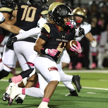 Running back Deshonne Redeaux finds an opening during the first quarter of Oaks Christian's 35-0 Marmonte League win over St. Bonaventure Friday night at Redell Field.