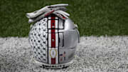 Jan 1, 2021; New Orleans, LA, USA;  An Ohio State Buckeyes helmet sits on the sideline during warm-ups prior to the College Football Playoff semifinal against the Clemson Tigers at the Allstate Sugar Bowl in the Mercedes-Benz Superdome in New Orleans on Friday, Jan. 1, 2021. Mandatory Credit: Adam Cairns-Imagn Images