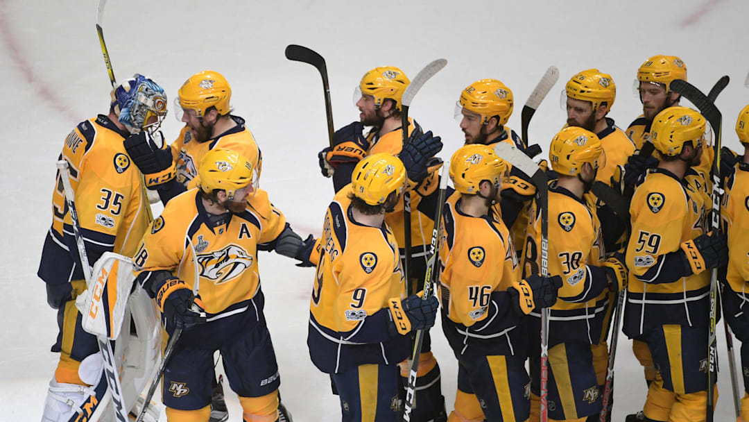 Jun 5, 2017; Nashville, TN, USA; Nashville Predators goalie Pekka Rinne (35) is congratulated by teammates after beating the Pittsburgh Penguins 4-1 in game four of the 2017 Stanley Cup Final at Bridgestone Arena. Mandatory Credit: Scott Rovak-Imagn Images