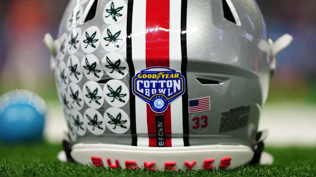 Dec 29, 2023; Arlington, Texas, USA; The helmet of Ohio State Buckeyes quarterback Devin Brown (33) sits on the sideline prior to the Goodyear Cotton Bowl Classic against the Missouri Tigers at AT&T Stadium.