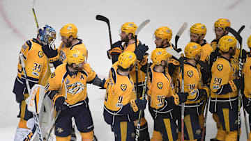 Jun 5, 2017; Nashville, TN, USA; Nashville Predators goalie Pekka Rinne (35) is congratulated by teammates after beating the Pittsburgh Penguins 4-1 in game four of the 2017 Stanley Cup Final at Bridgestone Arena. Mandatory Credit: Scott Rovak-Imagn Images