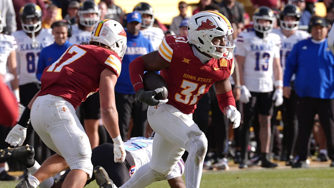 Iowa State Cyclones' defensive back Marcus Neal Jr. (31) runs with the ball after a interception against Kansas.