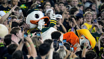 Oct 12, 2024; Eugene, Oregon, USA; The Oregon Duck mascot celebrates with fans in the second half against Ohio State Buckeyes during the NCAA football game at Autzen Stadium.