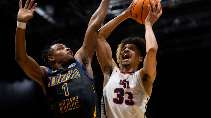 Southern Indiana’s Jeremiah Hernandez (33) is fouled by Morehead State’s Jerone Morton (1) as the University of Southern Indiana Screaming Eagles play the Morehead State Eagles at Screaming Eagles Arena in Evansville, Ind., Saturday, Jan. 20, 2024.
