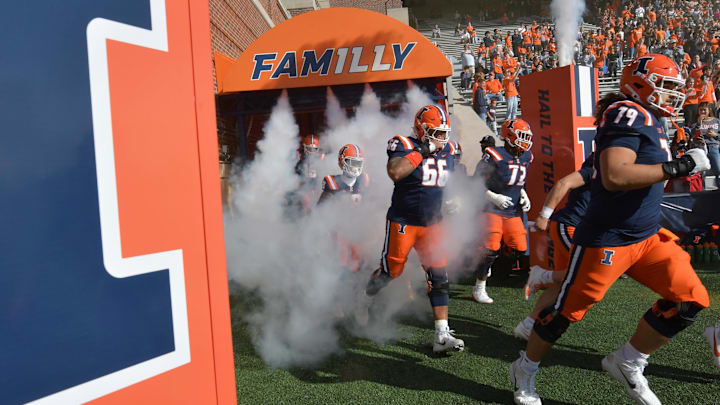 Oct 21, 2023; Champaign, Illinois, USA;  Illinois Fighting Illini players take the field for a game against the Wisconsin Badgers at Memorial Stadium. Mandatory Credit: Ron Johnson-Imagn Images