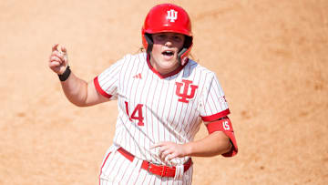 Indiana's Sarah Stone (14) celebrates hitting a homer as she rounds second base during a NCAA Regional softball game between Indiana and Louisville at Sherri Parker Lee Stadium in Knoxville, Tenn., on Friday, May 19, 2023.