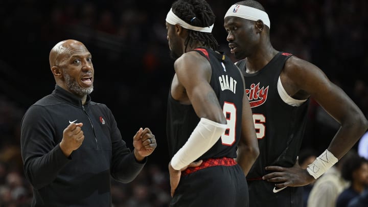 Feb 15, 2024; Portland, Oregon, USA; Portland Trail Blazers head coach Chauncey Billups talks to forward Jerami Grant (9) and center Duop Reath (26) during a break in the second half against the Minnesota Timberwolves at Moda Center. Mandatory Credit: Troy Wayrynen-USA TODAY Sports