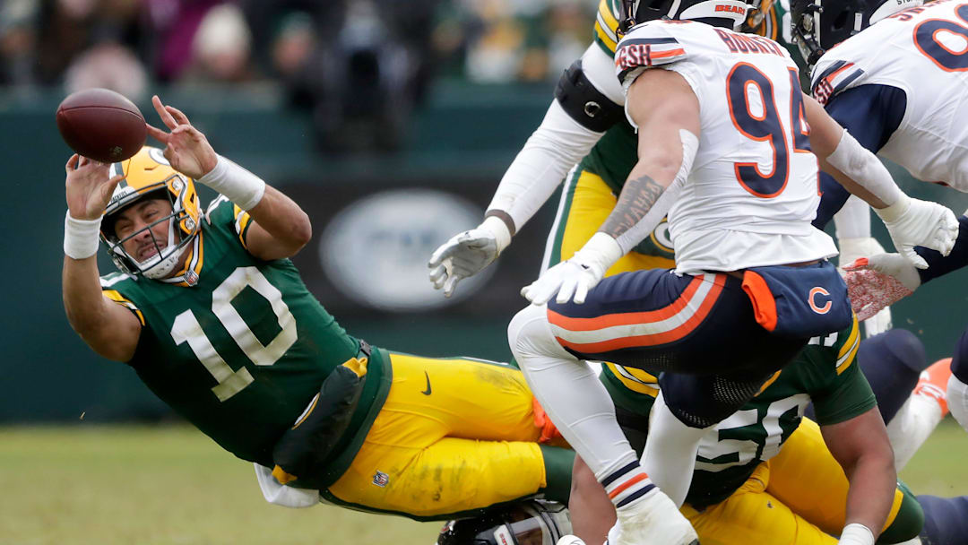 Green Bay Packers quarterback Jordan Love (10) is tackled by Chicago Bears defensive tackle Gervon Dexter Sr. (99) against the Chicago Bears on Sunday, January 5, 2024 at Lambeau Field in Green Bay, Wis. 
Wm. Glasheen USA TODAY NETWORK-Wisconsin