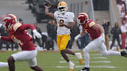 Arizona State Sun Devils quarterback Jeff Sims (2) passes the ball around Iowa State Cyclones' linebacker Cael Brezina (9) during the second quarter in the Big-12 showdown at jack Trice Stadium on Nov. 1, 2025, in Ames, Iowa.