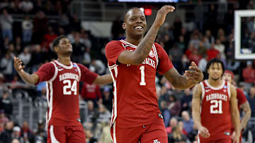 Arkansas senior guard Johnell Davis celebrates with teammates Billy Wagner (24) and D.J. Wagner (21) during Saturday's 75-66 win over St. John's in the second round of the 2025 NCAA Tournament.