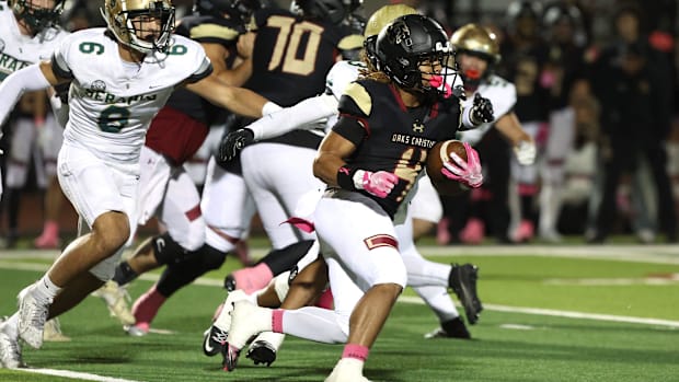 Running back Deshonne Redeaux finds an opening during the first quarter of Oaks Christian's 35-0 Marmonte League
