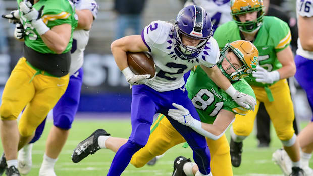 Anacortes wide receiver Brady Beaner pulls away from a defender in WIAA Class 2A championship game.