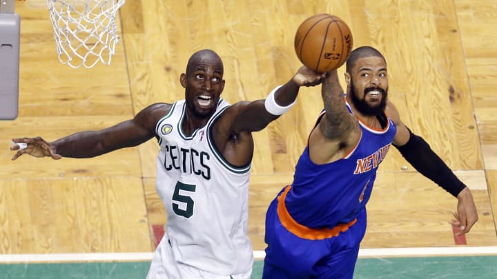 Apr 28, 2013; Boston, MA, USA; Boston Celtics center Kevin Garnett (5) and New York Knicks center Tyson Chandler (6) work for the rebound during overtime in game four of the first round of the 2013 NBA playoffs at TD Garden. The Celtics defeated the New York Knicks 97-90. Mandatory Credit: David Butler II-USA TODAY Sports