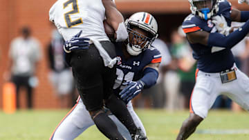 Alabama State Hornets running back Jacory Merritt (2) is taken down by Auburn Tigers linebacker Chandler Wooten (31) at Jordan-Hare Stadium in Auburn, Ala., on Saturday, Sept. 11, 2021. Auburn Tigers leads Alabama State Hornets 20-0 at halftime.