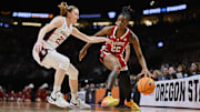 Mar 29, 2024; Portland, OR, USA;  NC State Wolfpack guard Saniya Rivers (22) drives to the basket during the first half against Stanford Cardinal guard Elena Bosgana (20) in the semifinals of the Portland Regional of the 2024 NCAA Tournament at the Moda Center at the Moda Center. Mandatory Credit: Troy Wayrynen-Imagn Images