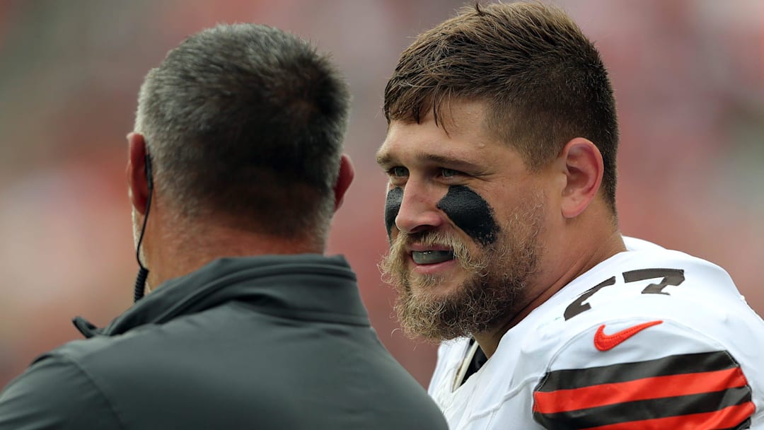 Cleveland Browns guard Wyatt Teller (77) chats with senior consultant Mike Vrabel on the sideline during the first half of an NFL preseason football game at Cleveland Browns Stadium, Saturday, Aug. 10, 2024, in Cleveland, Ohio.