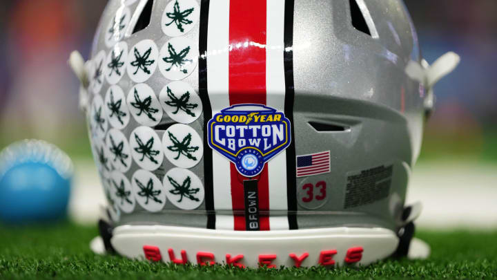 Dec 29, 2023; Arlington, Texas, USA; The helmet of Ohio State Buckeyes quarterback Devin Brown (33) sits on the sideline prior to the Goodyear Cotton Bowl Classic against the Missouri Tigers at AT&T Stadium.