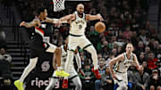 Mar 11, 2024; Portland, Oregon, USA; Boston Celtics guard Derrick White (9) steals a pass during the first half against Portland Trail Blazers guard Anfernee Simons (1) at Moda Center. Mandatory Credit: Troy Wayrynen-Imagn Images