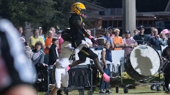The pass to Ja'bril Rawls (6) is broken up by Ryan Deal (12) during the Gulf Breeze vs Catholic football game at Pensacola Catholic High School in Pensacola on Thursday, Oct. 6, 2022.

Gulf Breeze Vs Catholic Football