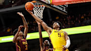 Minnesota center Trey Edmonds  shoots as Bethune-Cookman forwards Kalil Camara and Jarrell Love, left, defend during the first half at Williams Arena in Minneapolis on Dec. 1, 2024.
