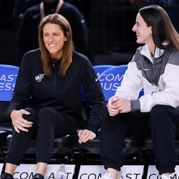Indiana Fever guard Caitlin Clark talks with head coach Stephanie White