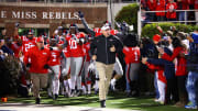 Head coach Hugh Freeze and the Ole Miss Rebels take the field prior to the 2012 Egg Bowl against the Mississippi State Bulldogs.