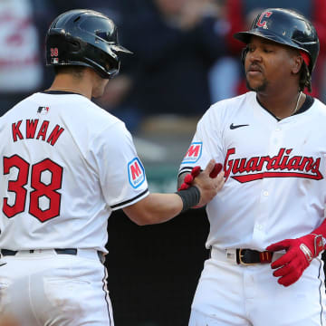 Cleveland Guardians third baseman Jose Ramirez (11) celebrates with Cleveland Guardians outfielder Steven Kwan (38) at home after his two-run homer during the fifth inning of the Cleveland Guardians' home opener against the Chicago White Sox, Monday, April 8, 2024, in Cleveland, Ohio.