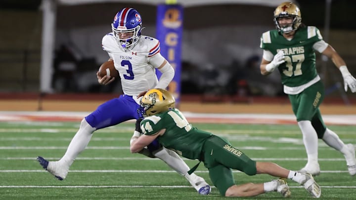 St. Bonaventure's Dylan Dunst tackles Folsom quarterback Ryder Lyons during the fourth quarter of the CIF-State Division 1-A state championship bowl at Saddleback College in Mission Viejo on Saturday, Dec. 9, 2023. St. Bonaventure lost 20-14.