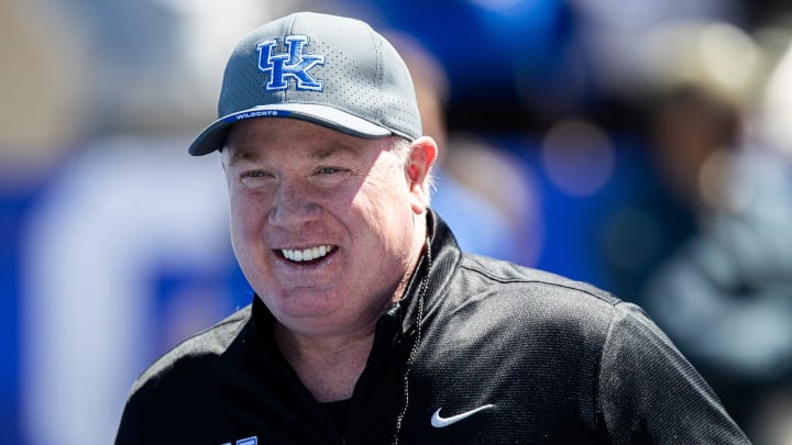 Kentucky head coach Mark Stoops smiled while walking onto the field before the Kentucky Wildcats' Blue White scrimmage at Kroger Field on Saturday afternoon in Lexington, Kentucky. April 13, 2024