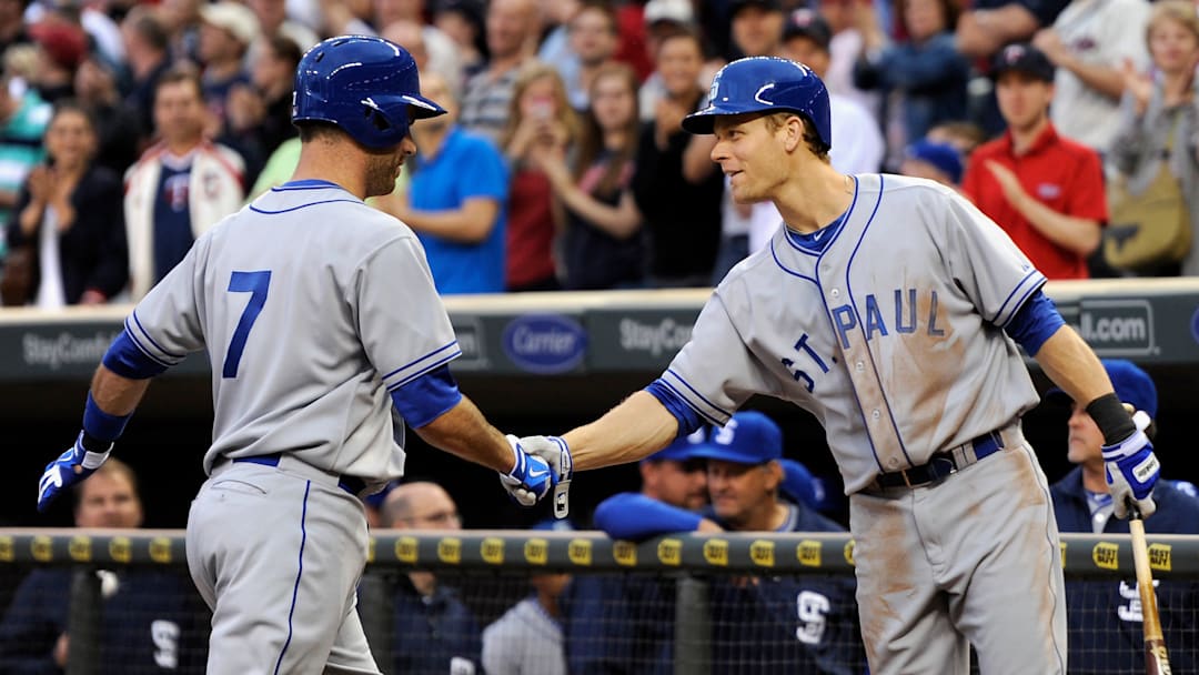 Justin Morneau and Joe Mauer wearing old school St. Paul Jerseys
