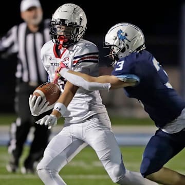 Little Chute High School’s Kaden Hoffman (3) attempts to tackle Waupaca's Westin Lauritzen (3) during a non-conference game on Friday, September 5, 2025. 
