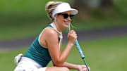 Paige Spiranac watches her teammates putt on the No. 6 green during the 2023 Kaulig Companies Championship Pro-Am at Firestone Country Club, Wednesday, July 12, 2023, in Akron, Ohio.