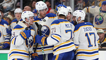 A group of Buffalo Sabres players including Ryan McLeod and Jason Zucker