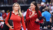 Former Wisconsin star Lauren Carlini, right, who recently rejoined the program as an offensive analyst and strategy consultant, talks with associate head coach Brittany Dildine as they walk off the court between sets in a match against Marquette on Tuesday, September 17, 2024, at the Kohl Center in Madison, Wisconsin.