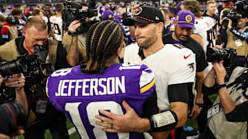 Dec 8, 2024; Minneapolis, Minnesota, USA; Atlanta Falcons quarterback Kirk Cousins (18) and Minnesota Vikings wide receiver Justin Jefferson (18) hug after the game at U.S. Bank Stadium. Mandatory Credit: Matt Krohn-Imagn Images