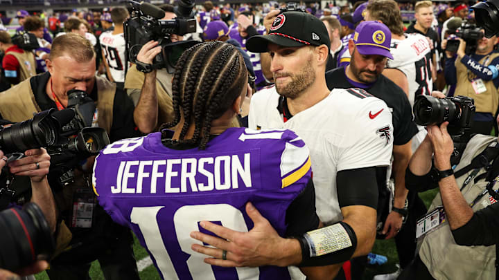 Dec 8, 2024; Minneapolis, Minnesota, USA; Atlanta Falcons quarterback Kirk Cousins (18) and Minnesota Vikings wide receiver Justin Jefferson (18) hug after the game at U.S. Bank Stadium. Mandatory Credit: Matt Krohn-Imagn Images
