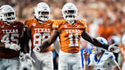 Texas Longhorns linebacker Colin Simmons (11) celebrates after a quarterback sack against the Kentucky Wildcats in the fourth quarter at Darrell K Royal Texas Memorial Stadium.