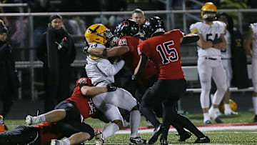 Gilbert's linebacker Will Hawthorne (43) and Gilbert's tight end/linebacker Bowen Kruse (42) take down Waverly-Shell Rock's wide receiver Jayden Stephens (24) after making a catch during the fourth quarter in the 4A first round high school football playoff at Gilbert High School onFriday, Nov. 1, 2024, in Gilbert, Iowa.