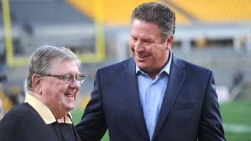 Oct 28, 2019; Pittsburgh, PA, USA; Former Miami Dolphins quarterback Dan Marino (right) talks with Bill Hillgrove, lead play by play broadcaster for the Pittsburgh Steelers before the Steelers play the Dolphins at Heinz Field. Mandatory Credit: Philip G. Pavely-USA TODAY Sports