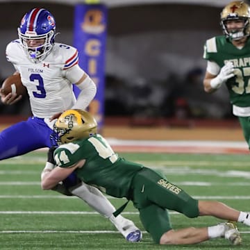 St. Bonaventure's Dylan Dunst tackles Folsom quarterback Ryder Lyons during the fourth quarter of the CIF-State Division 1-A state championship bowl at Saddleback College in Mission Viejo on Saturday, Dec. 9, 2023. St. Bonaventure lost 20-14.