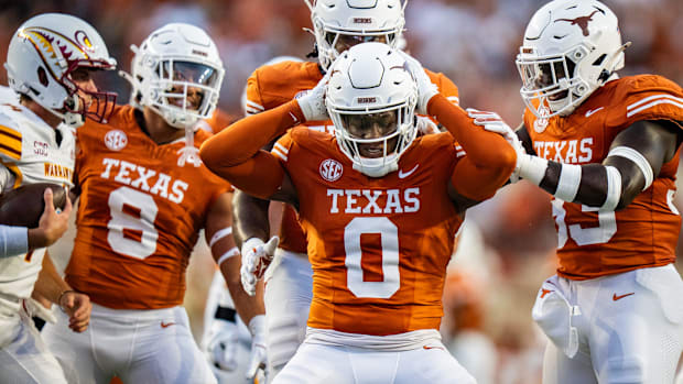 Texas Longhorns linebacker Anthony Hill Jr. (0) celebrates sacking Louisiana Monroe QB General Booty (14) on Sept. 21