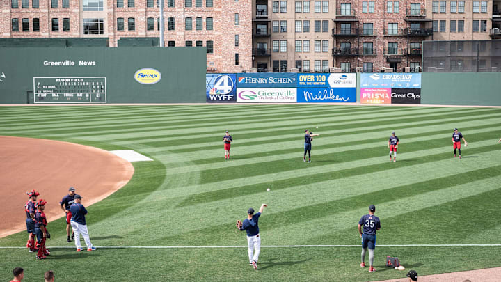 Boston Red Sox second baseman Dustin Pedroia warms up at Fluor Field with the Greenville Drive before their game against the West Virgina Power Apr. 4, 2019. The Greenville Drive is hosting Pedroia while on a major league injury rehab assignment this weekend

Dustinpedroia Mb65 04042019