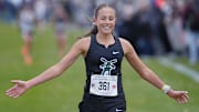 Pella’s Marissa Ferebee celebrates as finishing her race In the 3A girls state cross country meet at Lakeside Golf Course on Oct. 31, 2025, in Fort Dodge, Iowa. Ferebee won the 3A girls state cross country state title.
