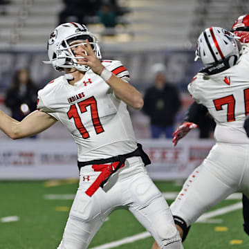 Peters Township quarterback Nolan DiLuca fires a pass against Imhotep Charter in the 2023 PIAA Class 5A state championship game. 