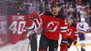 Nov 28, 2023; Newark, New Jersey, USA; New Jersey Devils center Michael McLeod (20) celebrates his goal against the New York Islanders during the first period at Prudential Center. Mandatory Credit: Ed Mulholland-Imagn Images