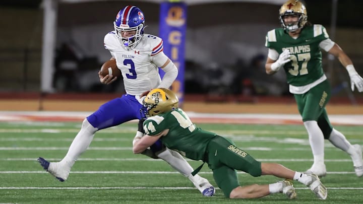 St. Bonaventure's Dylan Dunst tackles Folsom quarterback Ryder Lyons during the fourth quarter of the CIF-State Division 1-A state championship bowl at Saddleback College in Mission Viejo on Saturday, Dec. 9, 2023. St. Bonaventure lost 20-14.