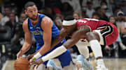 Nov 24, 2025; Miami, Florida, USA; Dallas Mavericks guard Klay Thompson (31) and Miami Heat center Bam Adebayo (13) battle for a loose ball during the second half at Kaseya Center. Mandatory Credit: Jim Rassol-Imagn Images