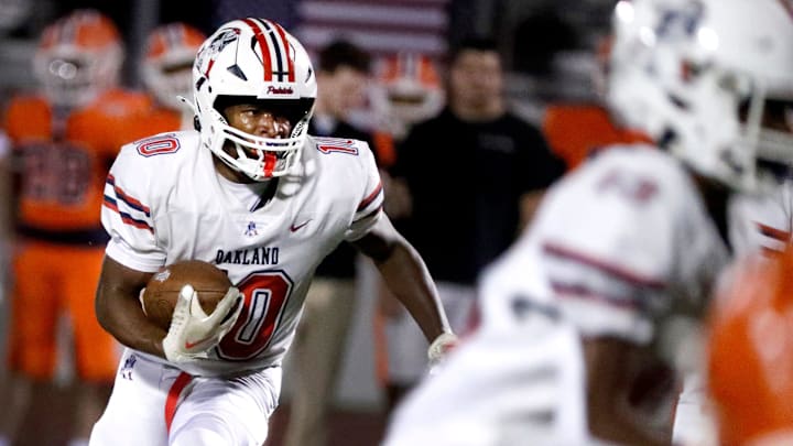 Oakland's TT Hill (10) runs the ball during a football game against Blackman at Blackman, on Friday, Sept. 20, 2024.