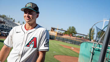Second baseman, Tommy Troy speaks to a vendor at Arizona Fall League media day at Scottsdale Stadium on Oct. 4, 2024, in Scottsdale, Arizona.